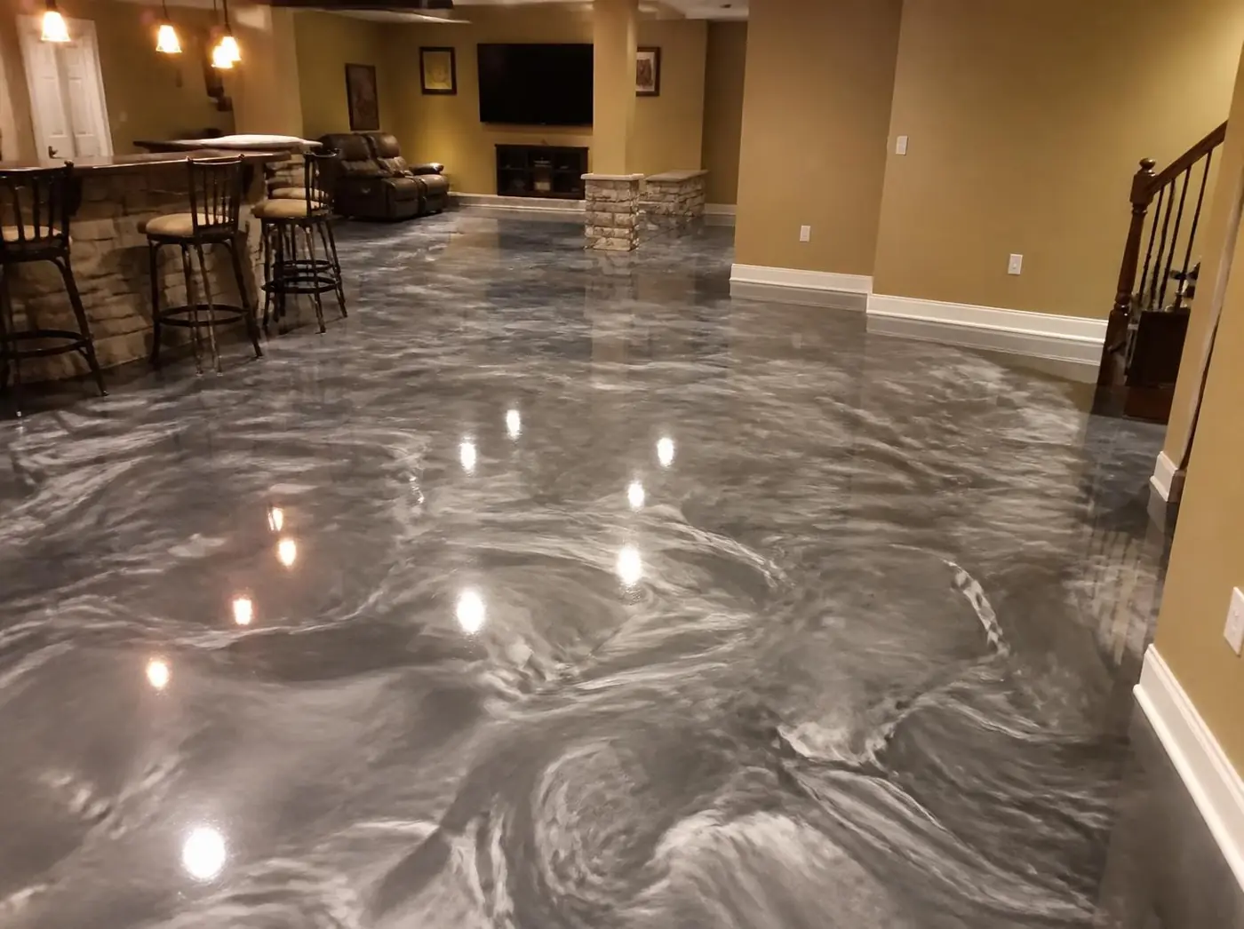Silver and charcoal metallic epoxy floor in a finished basement